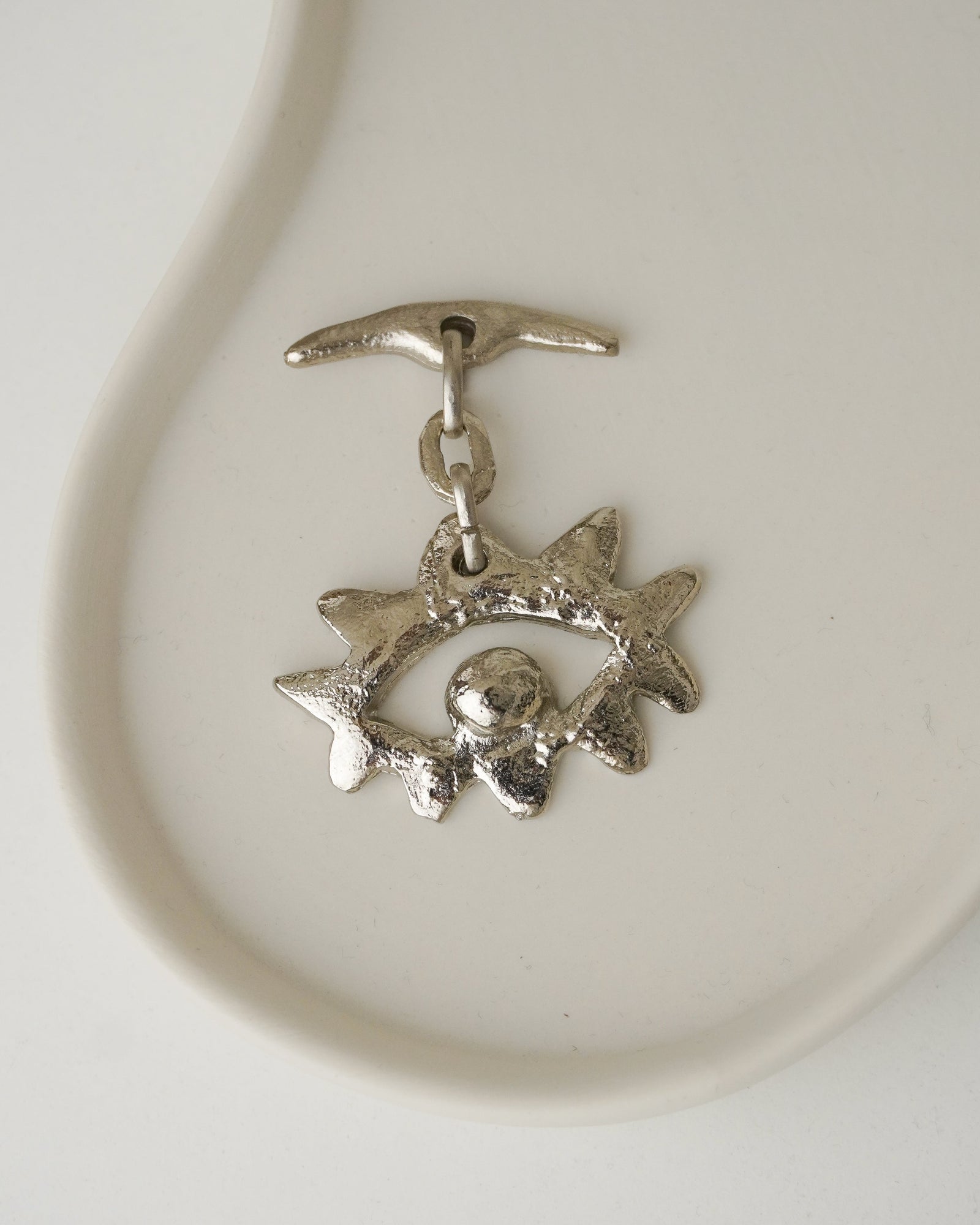 Dije Metal Plateado